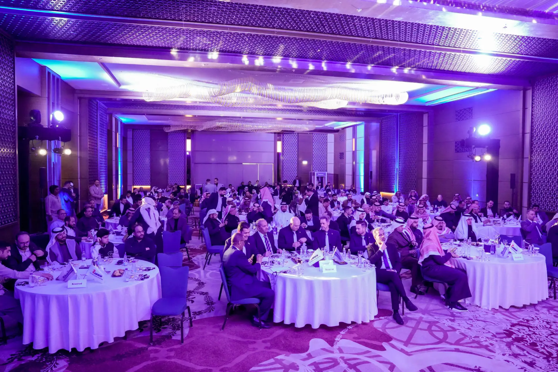 Guests at a gala dinner and award evening in a Riyadh hotel ballroom, produced by Eventia
